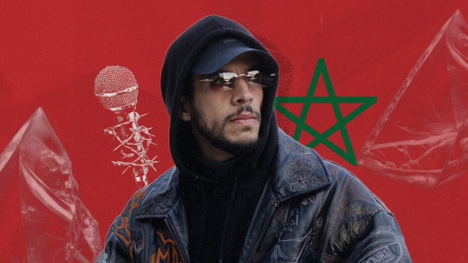 Portrait of Moroccan rapper and filmmaker El Mahdi Lyoubi (Mehdi Black Wind) against a Moroccan flag background with a microphone wrapped in chains, symbolizing restrictions on artistic freedom and freedom of expression.